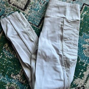 Athleta Rainier High Rise Leggings in a light gray color.